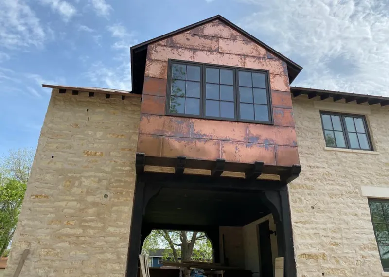 Copper metal panel facade on a stone building for Metal Roof Coating in Montague